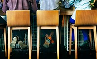 Rear view of diverse people sitting together at coffee cafe