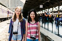 Young tourists at train station