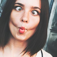 Young woman doing the fish face