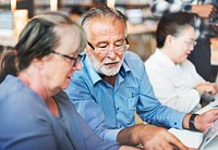 Seniors studying together at the library