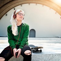 Skater girl listening to music