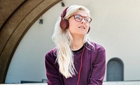 Young Woman Skater Listening Music Concept