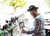 Restaurant owner doing inventory in the bar