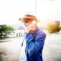 Elderly man is using mobile phone