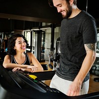 Couple working out together in the gym