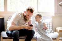 Father Daughter Using Devices Concept
