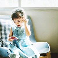 Kid Using Smart Phone Connection Listening Concept
