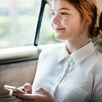 Young caucasian woman is using mobile phone