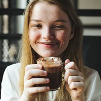Blond girl enjoy hot chocolate