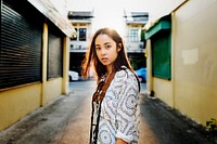 Closeup of young asian woman standing on street side