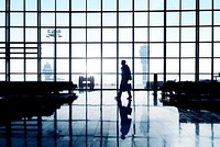 Lone Silhouette Of A Businessman In Airport Terminal
