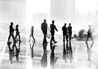 Silhouettes of Business People Wllking Inside the Offce