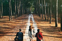 Group of friends travel in the forest together