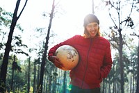 Guy Holding Globe Outdoors Concept