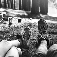 Couple Legs Relaxing Camping Outdoors Concept