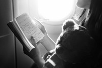 Woman Reading Book Plane Flying Concept