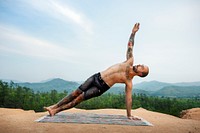 Man doing yoga in the nature