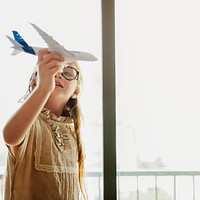 Girl Playing Plane Toy Concept