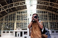 Caucasian photographer at the train station