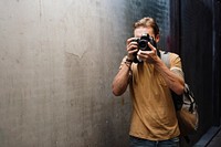 Caucasian photographer man at the train station