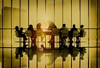 Silhouettes of business people in a conference room Concept