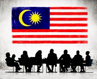 Silhouettes of Business People and a Flag of Malaysia