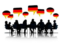 Talking Business People Silhouettes Isolated On White With German Flag Speech Bubble