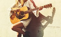 Beautiful country girl with her guitar