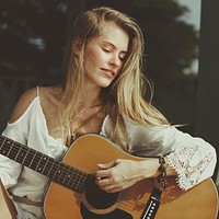 Beautiful singer songwriter with her guitar