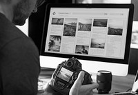 A man editing photos on a acomputer