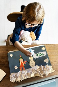 Children having fun with snowman artwork