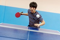 Asian guy playing table tennis