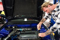 A mechanic fixing a car