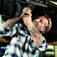 A mechanic fixing a car