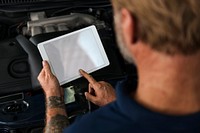 Auto Repair Shop Owner Checking Tablet Concept