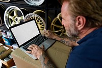 Car Parts Shop Owner Warehouse Checking Laptop Concept