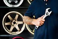 A mechanic holding a wrench