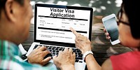 Senior couple filling out an online visa application