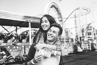 Teenage Couple Amusement Park Hugging Concept