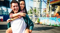 Teenage Couple Amusement Park Hugging Concept