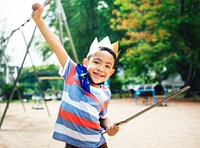 Boy playing king at a playground