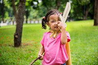 Little girl with a paper sword