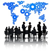 Business People Discussing Around The Conference Table And A Blue Cartography Of The World Made Of Gears Above