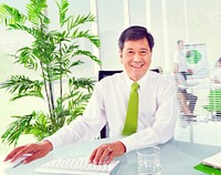 Senior businessman in a green office