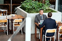 Two Businessmen Cafe Meeting Laptop Concept