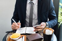Cropped Businessman Writing Notes Journal Concept