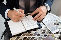 Cropped Businessman Writing Notes Journal Concept