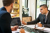 Two Businessmen Cafe Meeting Laptop Concept