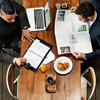 Businessmen Cafe Working Newspaper Concept
