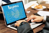 Business word puzzle with hands typing